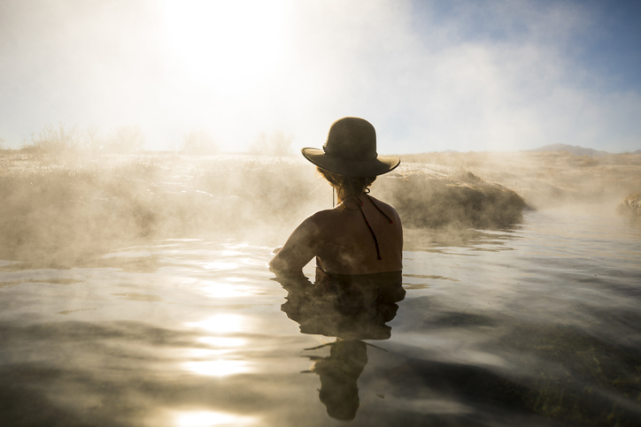 A woman soaking in a natural hot spring.