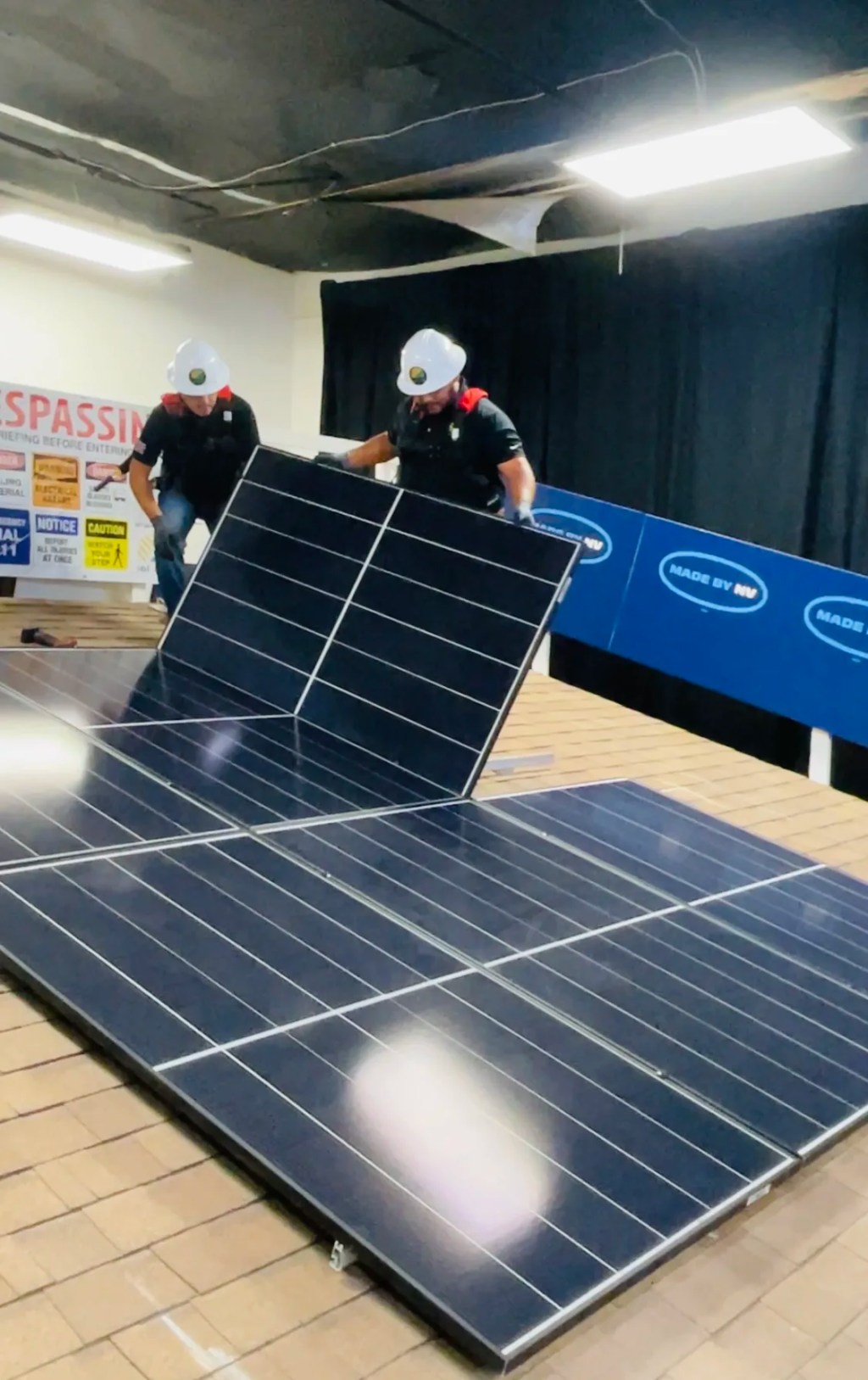 Green energy workers conduct solar panel demonstration in Las Vegas