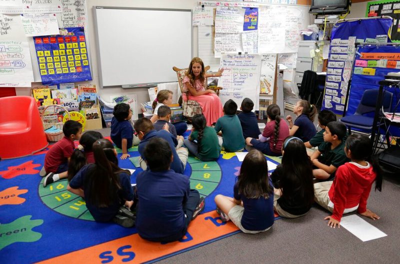 First grade teacher Lisa Cabrera-Terry, center, leads the class in a reading exercise at Jay W. Jeffers Elementary School, in Las Vegas.