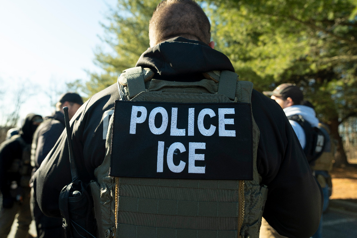 image depicting an ICE officer in uniform