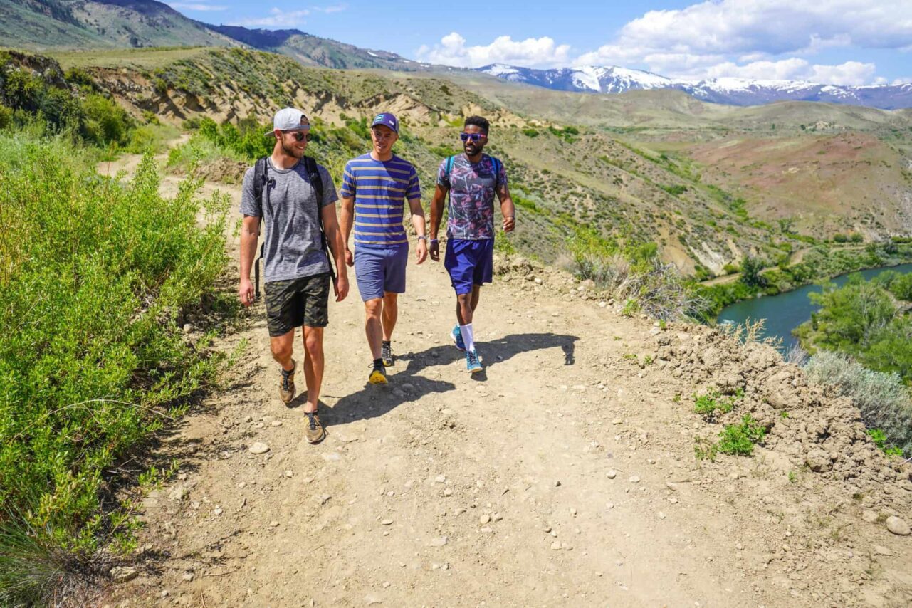 People walking along Hunter Creek Falls Trail 