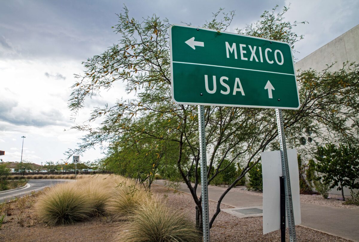 Signpost at the US-Mexican border. (Chess Ocampo/Shutterstock)