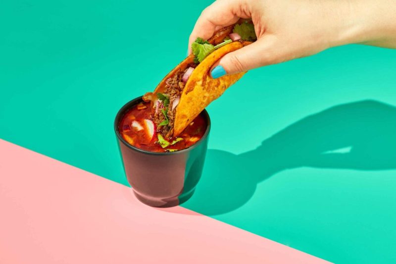 This slow-cooked soup of goat meat and spices, often served in tacos with consommé, is the hottest U.S. trend in tacos.
