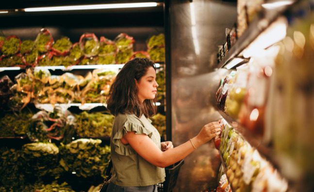 A woman shops for produce