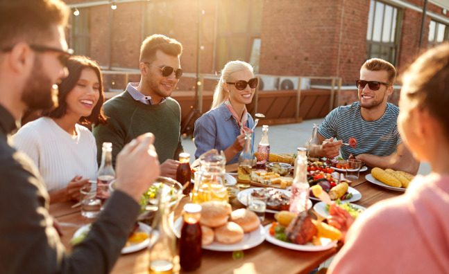 friends eating and drinking on a patio