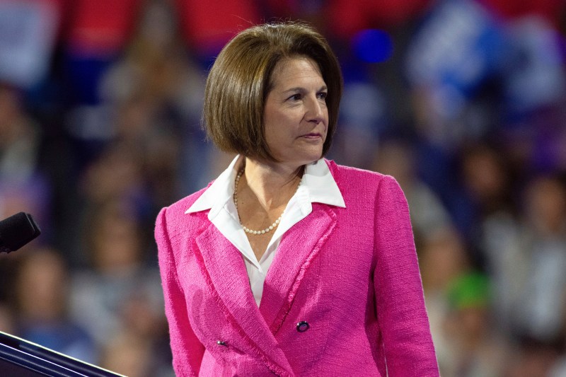 Sen. Catherine Cortez Masto in a pink suite at a rally.