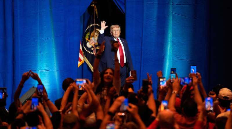 President Donald Trump waves to a rally of people in Las Vegas.