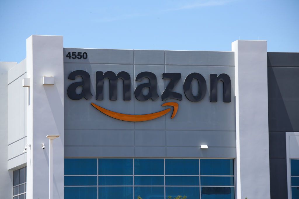 Amazon warehouse facade.
Nevada's largest employers, Walmart and Amazon, say the state included part-time and seasonal workers in their counts and that their full-time hourly employees make too much to qualify for Medicaid.